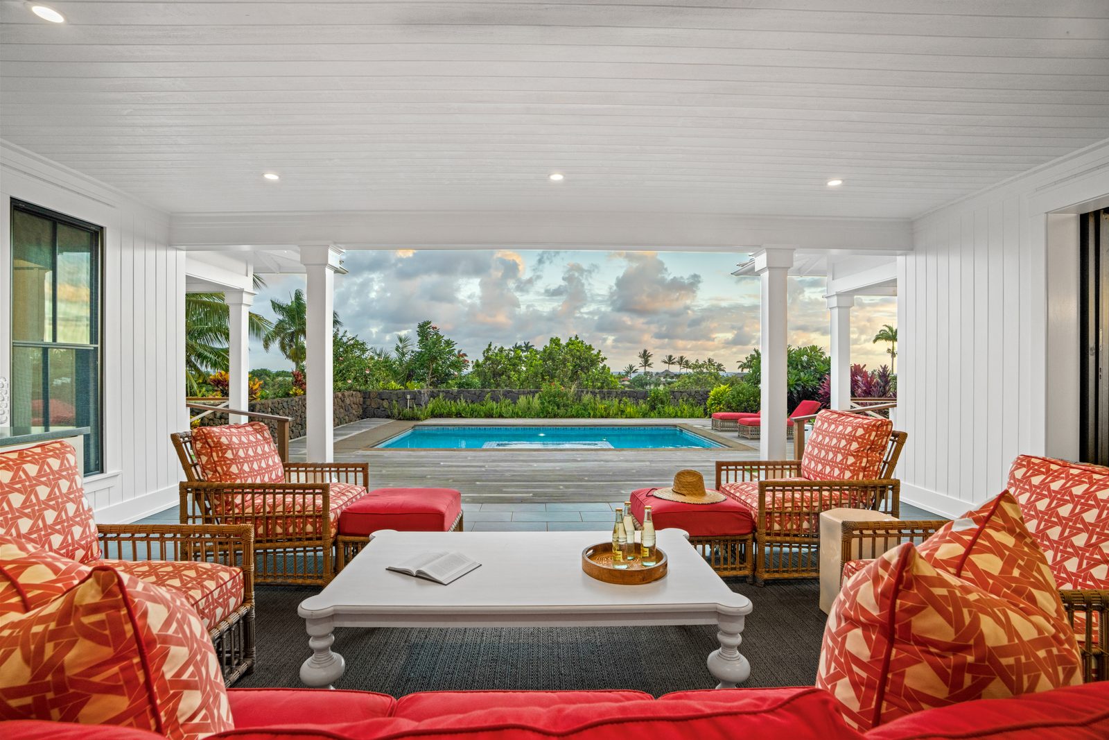 The lanai framing the pool and the evening sky