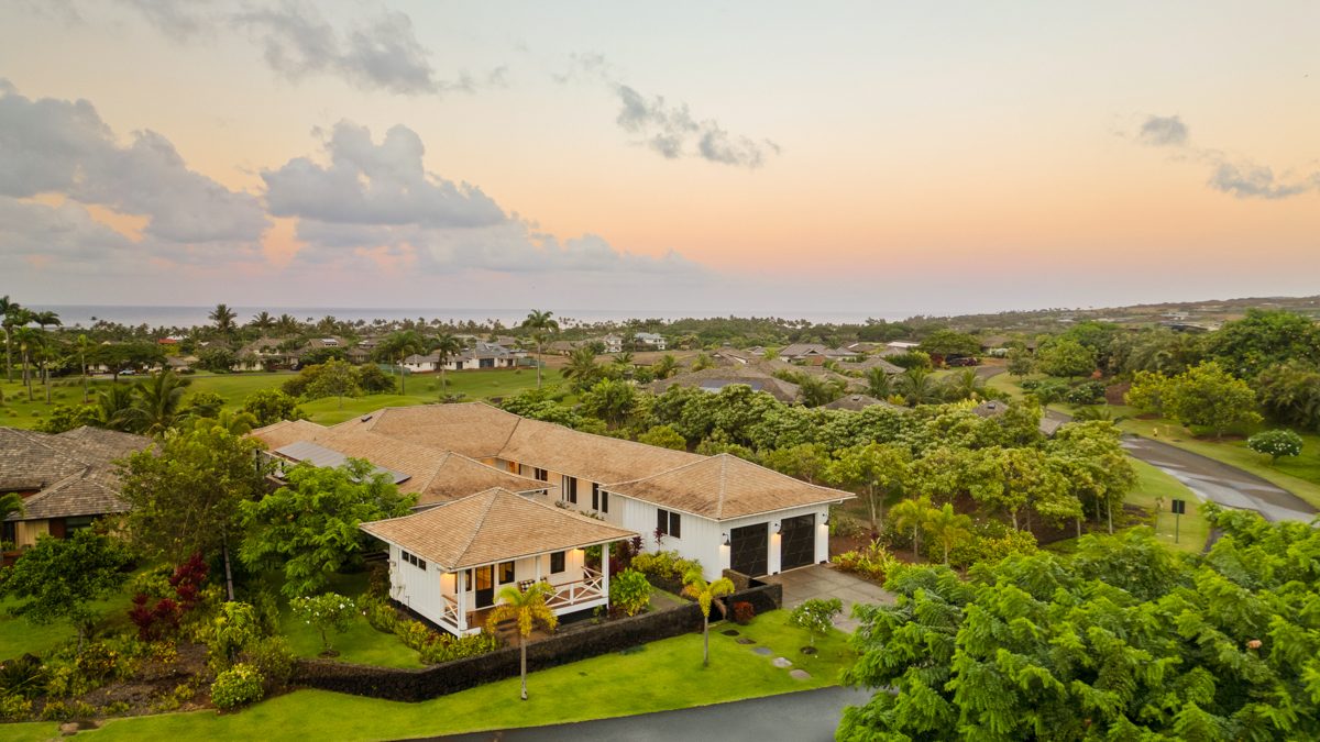 The house from above at sunset, the ocean on the horizon